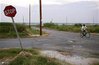 Robert Green Sr. cycles past vacant lots near the site where the 
levee was breached during Hurricane Katrina in the Lower Ninth Ward of 
New Orleans, Louisiana, August 26, 2007. (Lee Celano/Reuters)