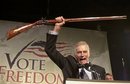 National Rifle Association president Charlton
 Heston addresses gun owners during a 'get-out-the-vote' rally Monday, 
Oct. 21, 2002, in Manchester, N.H.  Heston, who won the 1959 best actor 
Oscar as the chariot-racing 'Ben-Hur' and portrayed Moses, Michelangelo,
 El Cid and other heroic figures in movie epics of the '50s and '60s, 
died Saturday April 5, 2008 according to a statement from the actor's 
family. He was 84. (AP Photo/Jim Cole, FILE)