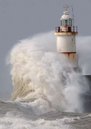 Stormy seas hit coastal sea defences and
 a lighthouse at Seaford in Sussex in southern England March 10, 2008. A
 storm rushing in from the Atlantic lashed the south west on Monday as 
high winds and tides brought the risk of coastal flooding.    
REUTERS/Toby Melville      (BRITAIN)